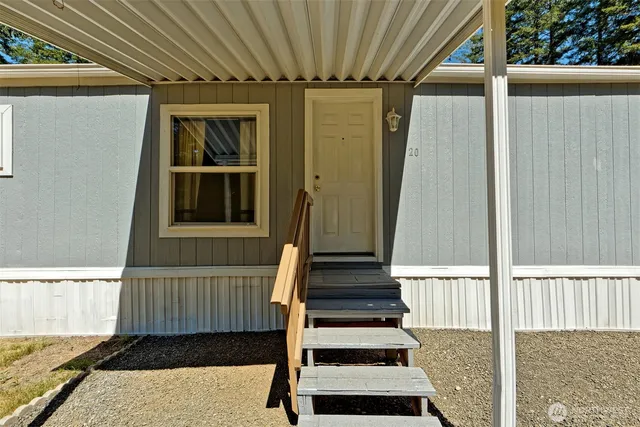a view of a house with wooden floor and iron stairs