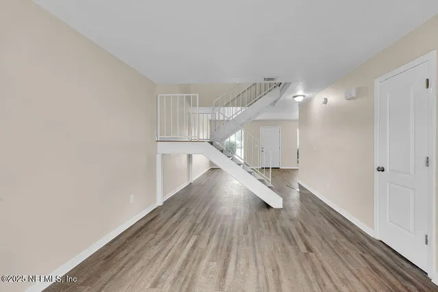 a view of entryway with wooden floor