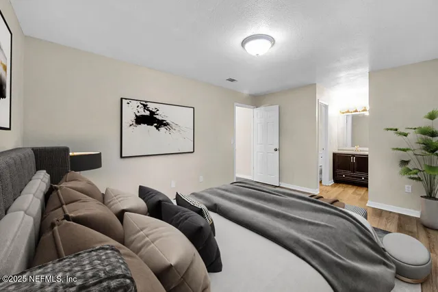 a bedroom with a bed and a couch