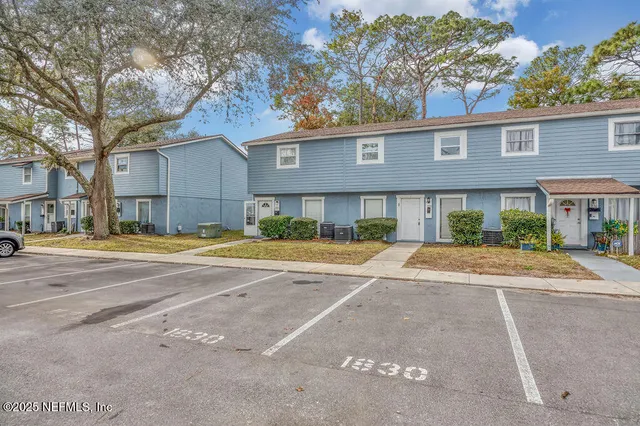 a view of street with a building in the background