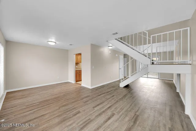 a view of entryway with wooden floor