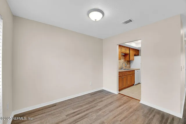 a view of a storage & utility room with wooden floor
