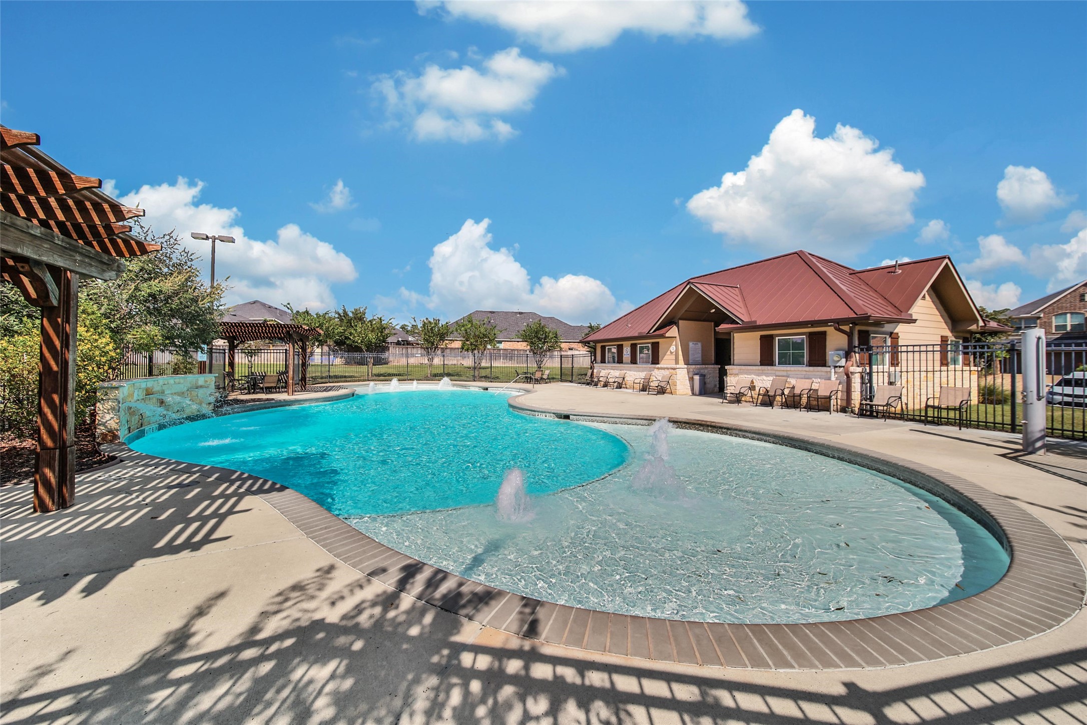214 Pleasant Hill Way Conroe, TX 77304 - Photo 34 of 43 The community pool is sure to please all ages with shallow ledges on the sides and a deeper swimming area in the middle.
