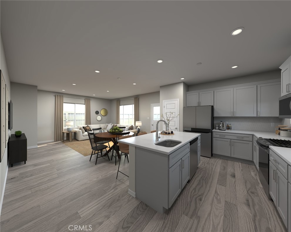 28485 Via Rioja Temecula, CA 92591 - Photo 4 of 9 a kitchen with a sink and wooden floor