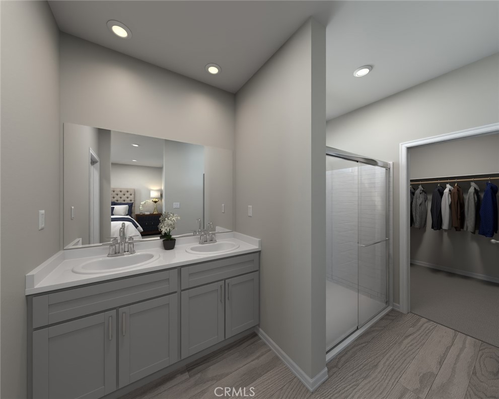 28485 Via Rioja Temecula, CA 92591 - Photo 7 of 9 a en suite bathroom with a double vanity sink and mirror