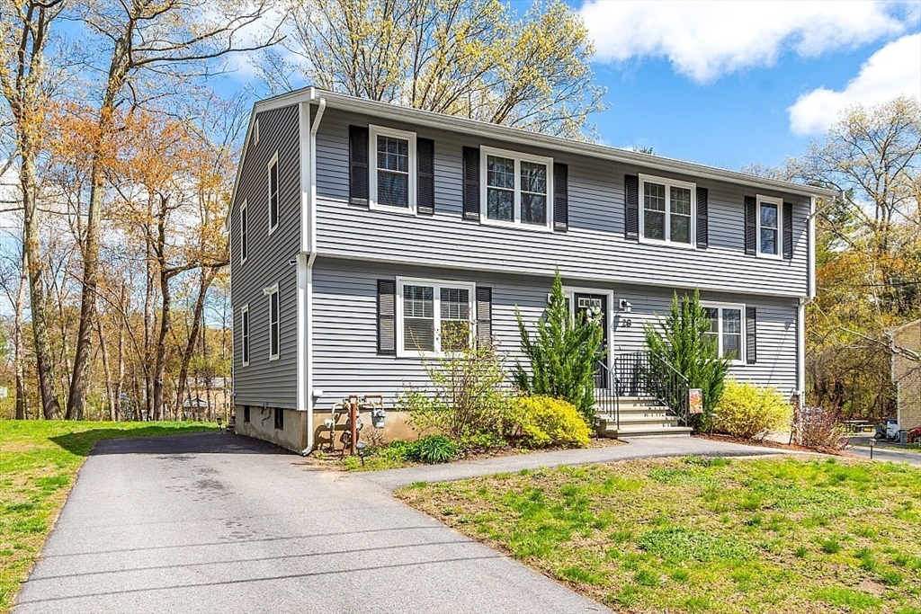 26 Pondover Road, Unit 26 Billerica, MA 01821 - Photo 1 of 23 a front view of a house with a yard