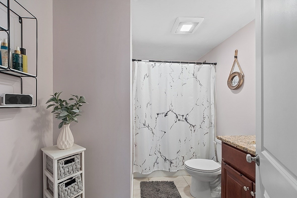 26 Pondover Road, Unit 26 Billerica, MA 01821 - Photo 15 of 23 a bathroom with a toilet sink and shower