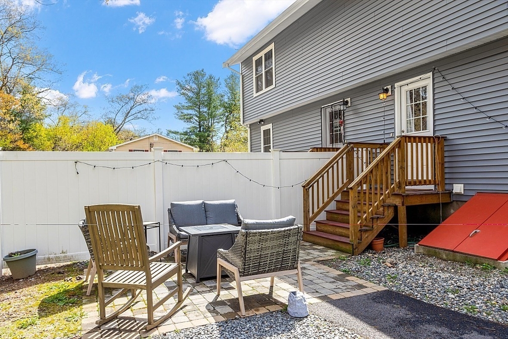 26 Pondover Road, Unit 26 Billerica, MA 01821 - Photo 20 of 23 a patio with table and chairs