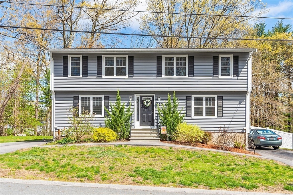 26 Pondover Road, Unit 26 Billerica, MA 01821 - Photo 23 of 23 front view of a house with a yard