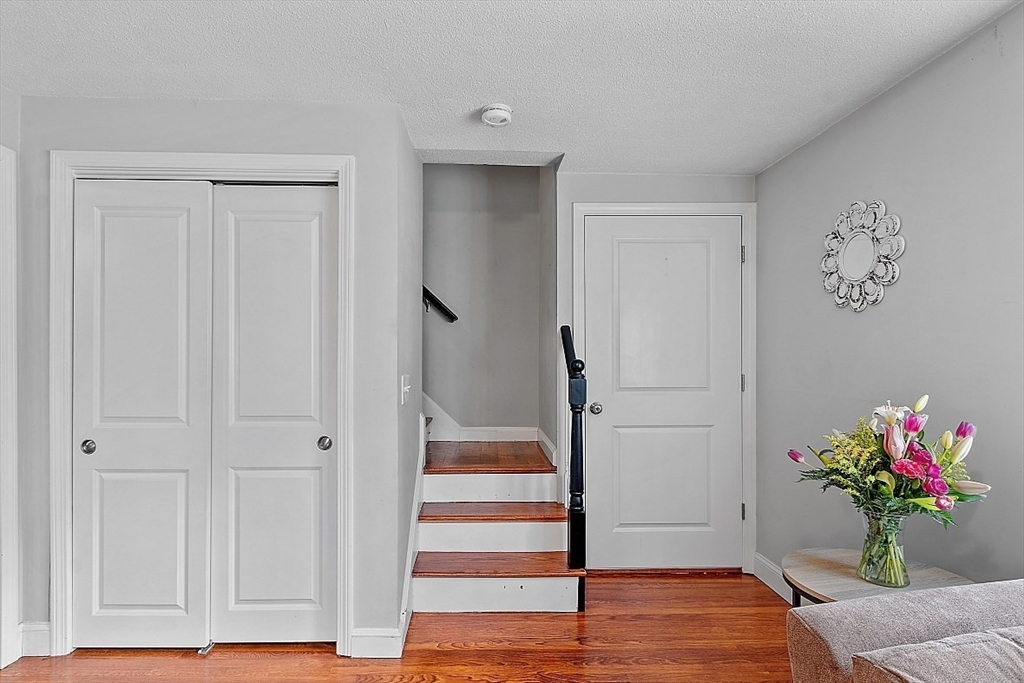 26 Pondover Road, Unit 26 Billerica, MA 01821 - Photo 8 of 23 a living room with white furniture and wooden floor