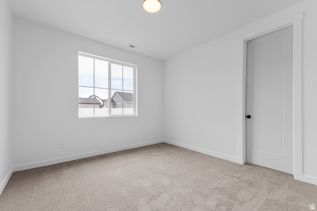 1869 South 2425 West Ogden, UT 84401 - Photo 16 of 22 Unfurnished room featuring light colored carpet and baseboards