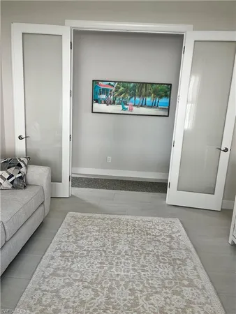 a living room with furniture and a rug