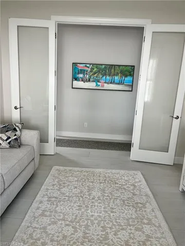 a living room with furniture and a rug