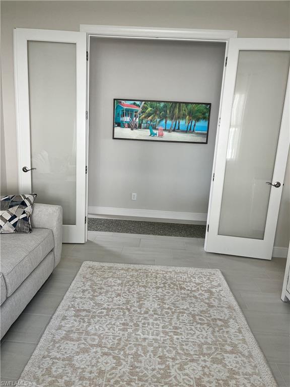 9195 Cayman Drive Naples, FL 34114 - Photo 14 of 29 a living room with furniture and a rug