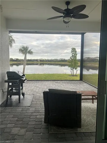 a living room with a table and a fireplace