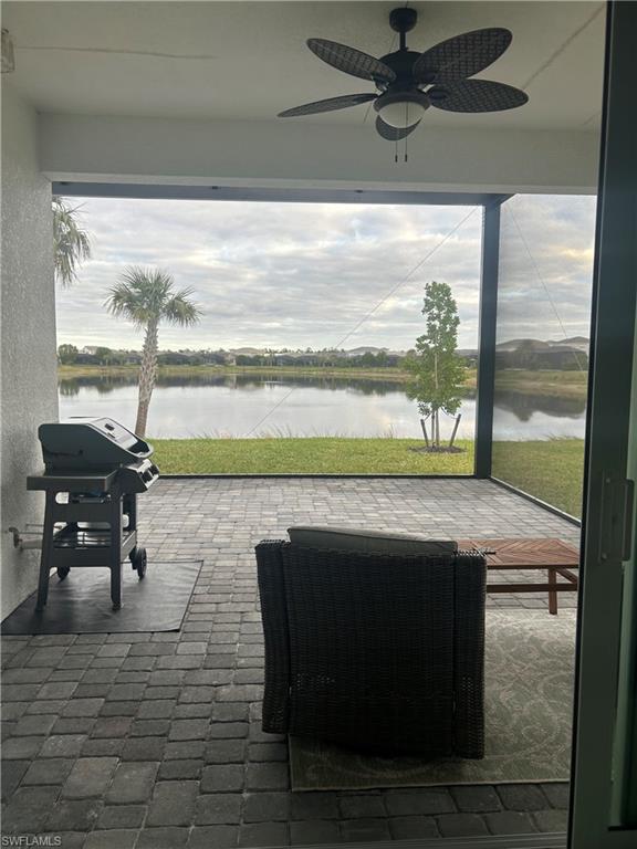 9195 Cayman Drive Naples, FL 34114 - Photo 19 of 29 a living room with a table and a fireplace