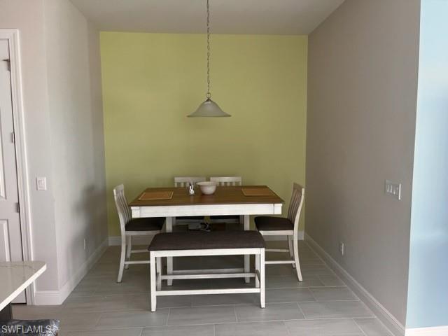 9195 Cayman Drive Naples, FL 34114 - Photo 5 of 29 a view of a room with a table and chairs
