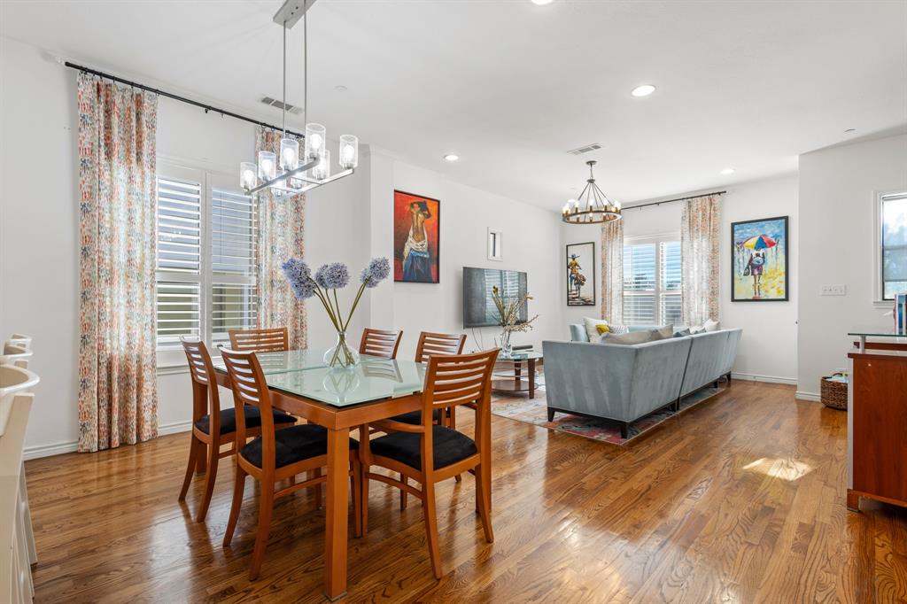 13900 Noel Road, Unit 23 Dallas, TX 75240 - Photo 11 of 28 a view of a dining room with furniture window and wooden floor