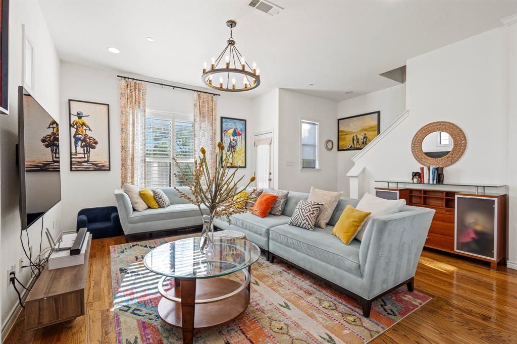 13900 Noel Road, Unit 23 Dallas, TX 75240 - Photo 12 of 28 a living room with furniture and wooden floor