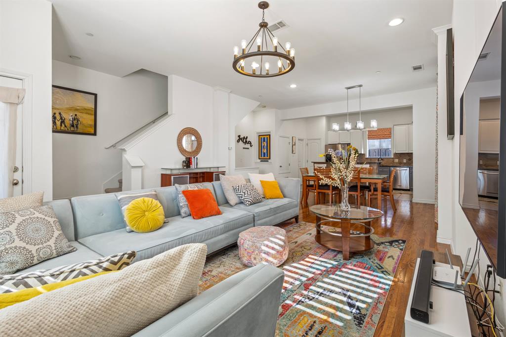 13900 Noel Road, Unit 23 Dallas, TX 75240 - Photo 14 of 28 a living room with furniture and wooden floor