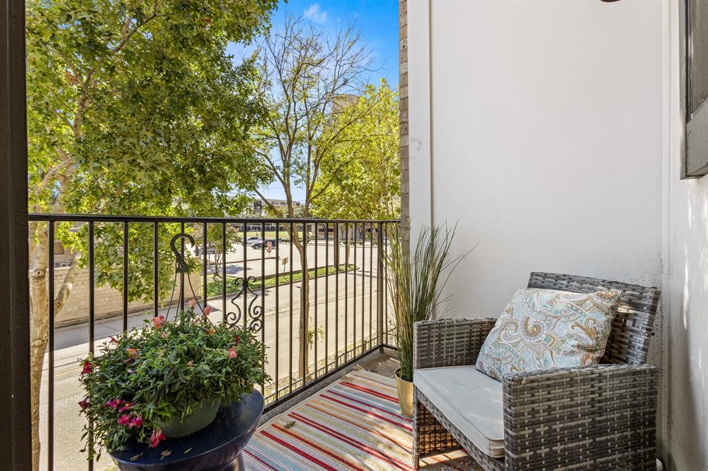 13900 Noel Road, Unit 23 Dallas, TX 75240 - Photo 15 of 28 a view of a balcony with furniture