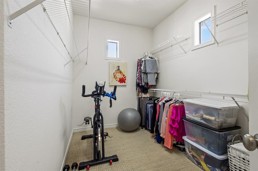 13900 Noel Road, Unit 23 Dallas, TX 75240 - Photo 21 of 28 a view of a room with gym equipment