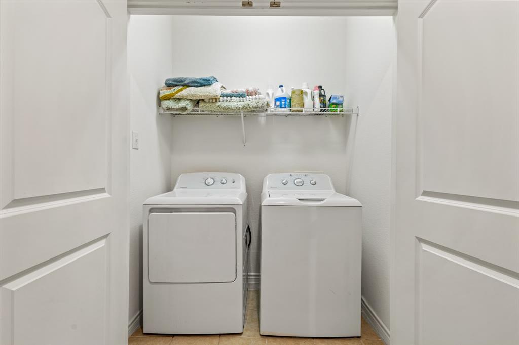 13900 Noel Road, Unit 23 Dallas, TX 75240 - Photo 22 of 28 a utility room with dryer and washer