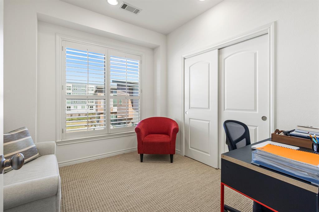 13900 Noel Road, Unit 23 Dallas, TX 75240 - Photo 23 of 28 a living room with furniture and windows