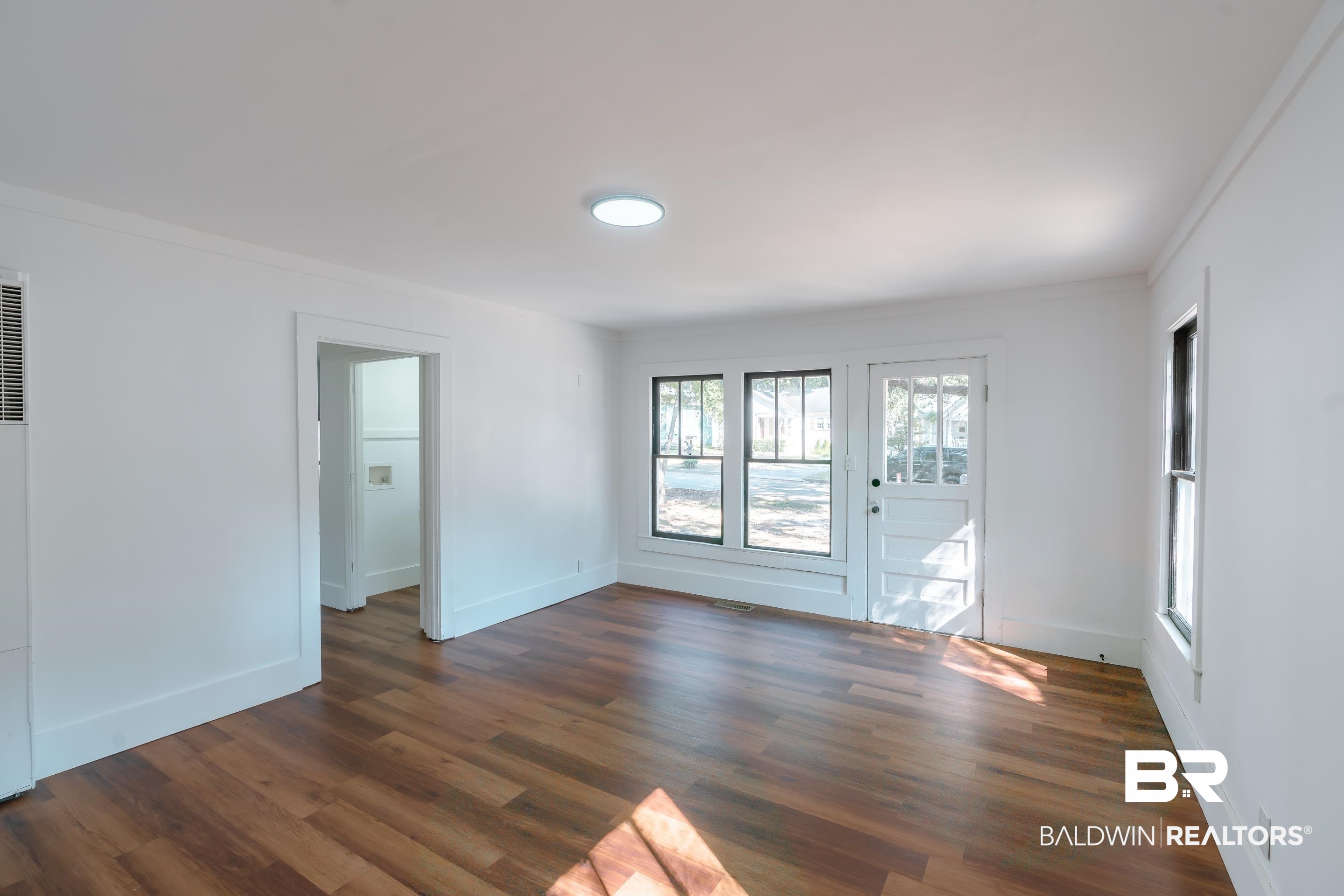 166 Crenshaw Street Mobile, AL 36606 - Photo 9 of 24 Unfurnished room featuring ornamental molding and dark hardwood / wood-style floors