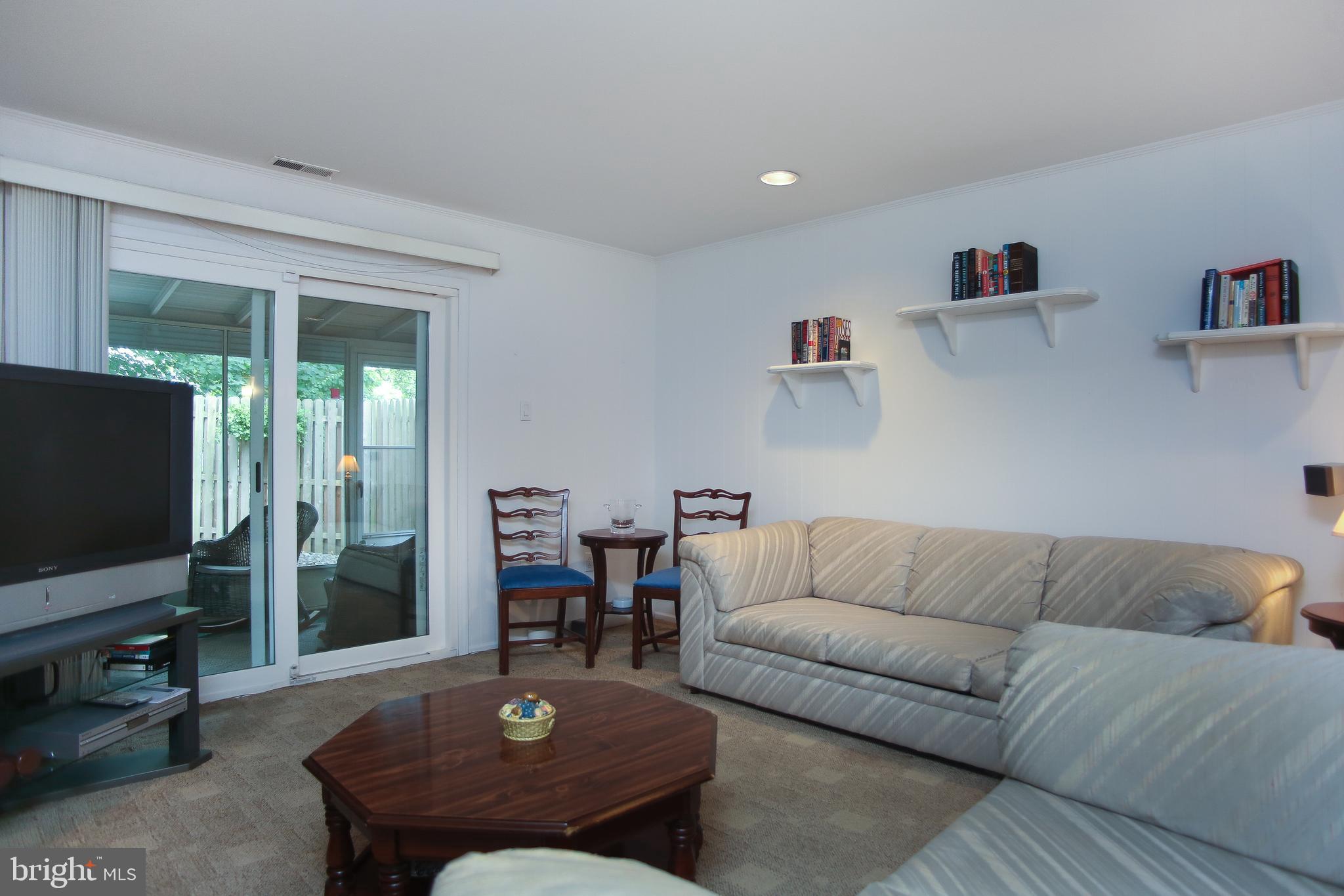 242 Springfield Avenue Philadelphia, PA 19118 - Photo 14 of 24 Den sliders to screened porch
