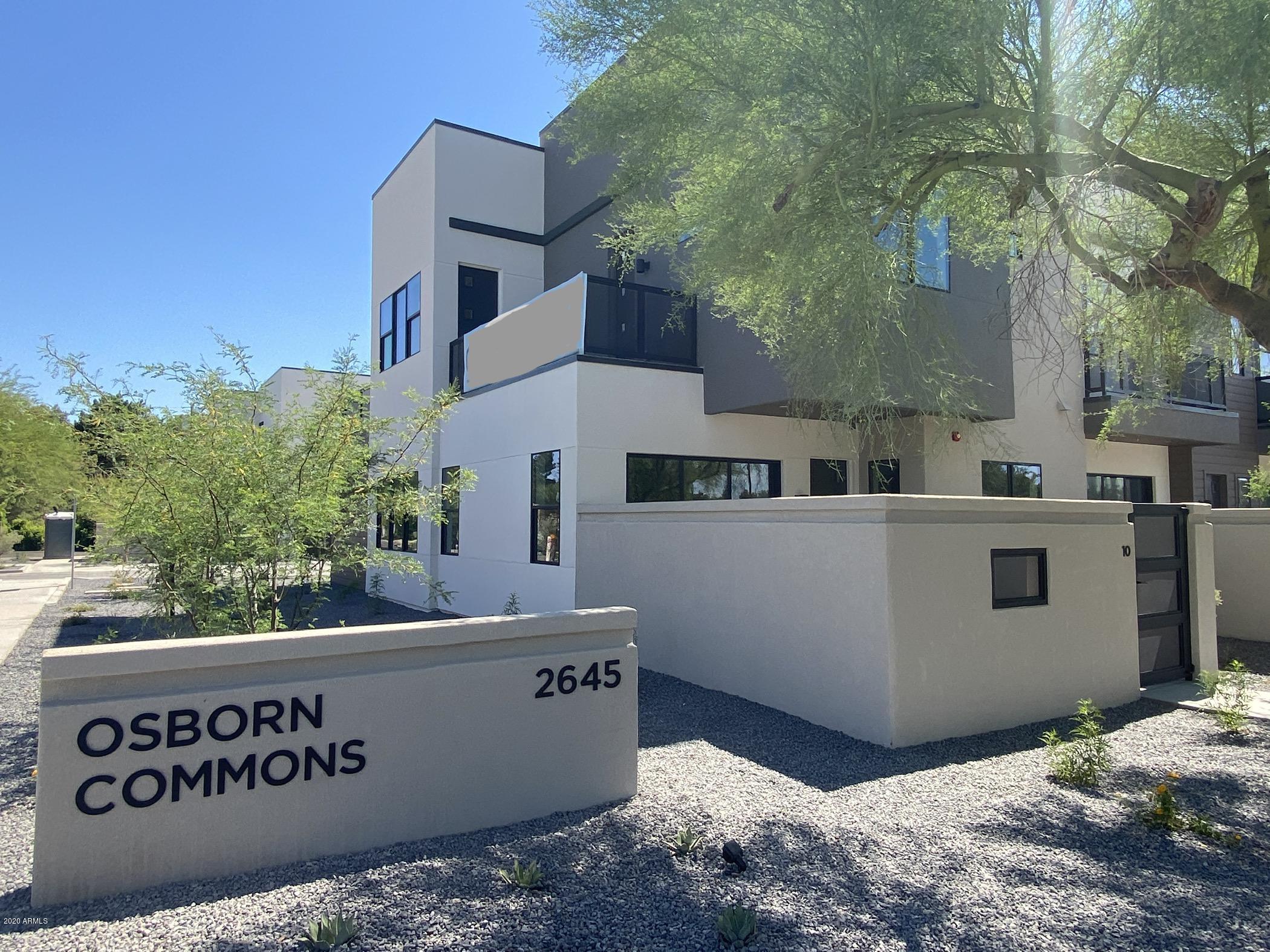 a view of backyard with a sign board