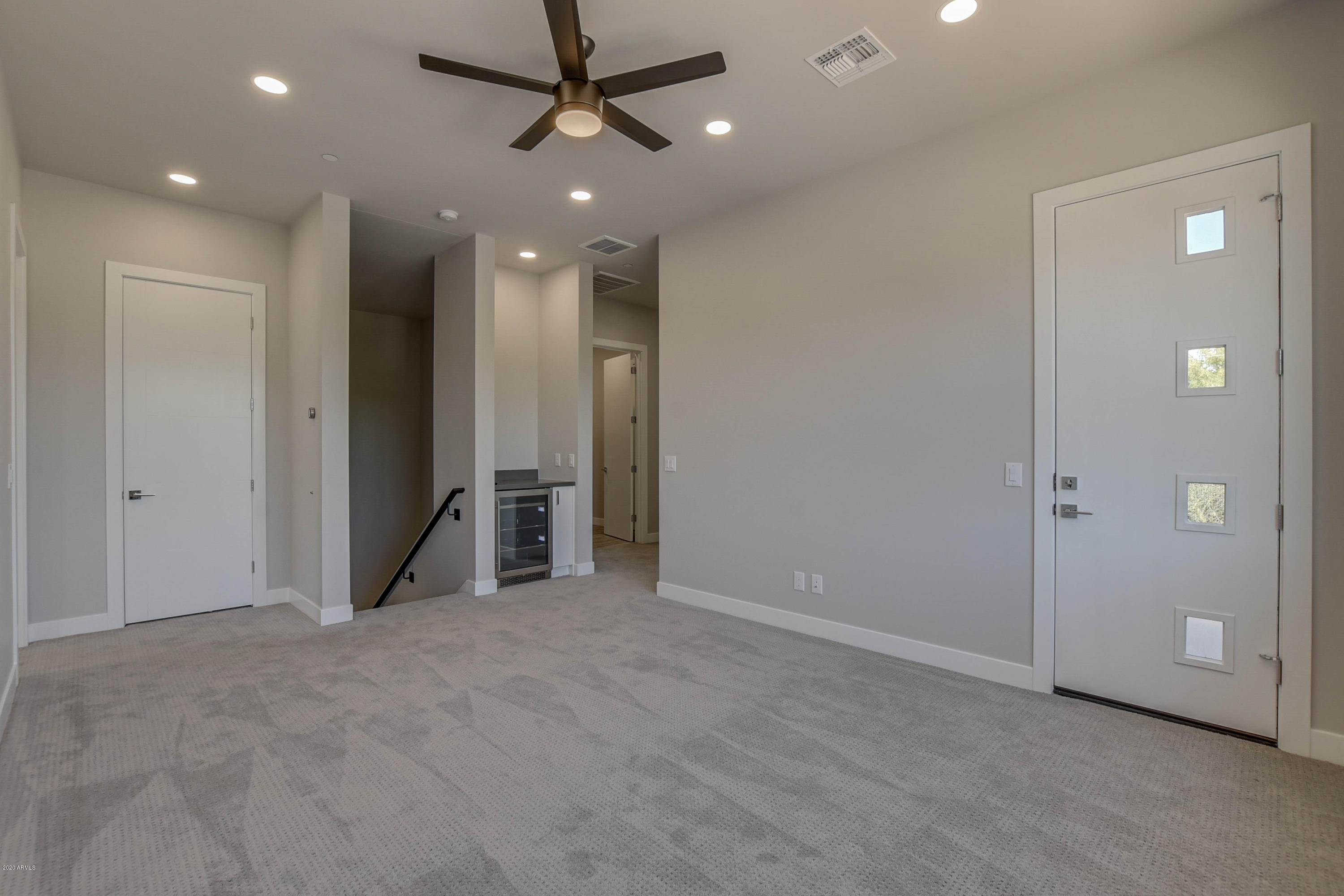 2645 East Osborn Road, Unit 6 Phoenix, AZ 85016 - Photo 15 of 43 an empty room with closet and a chandelier fan