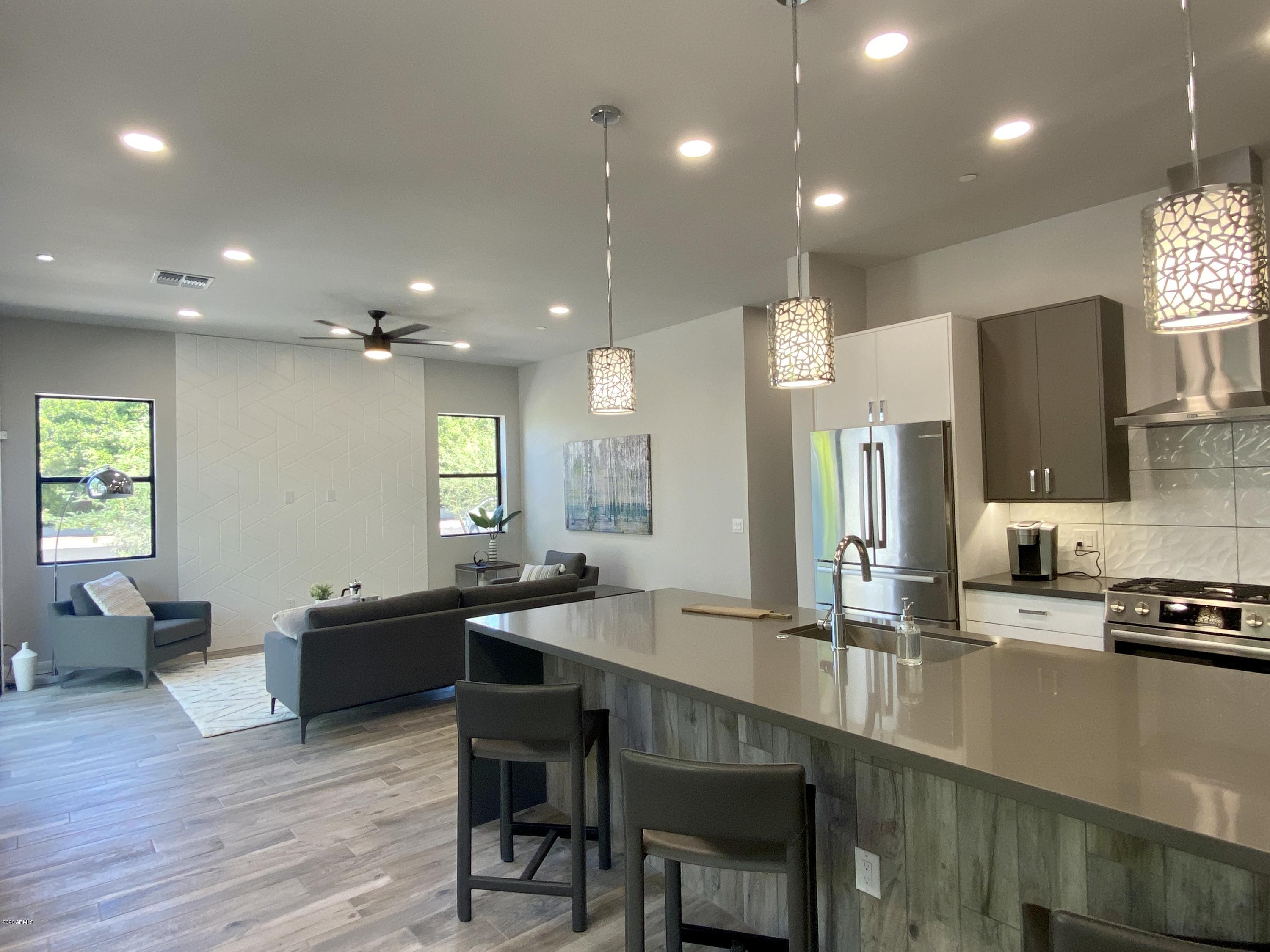 2645 East Osborn Road, Unit 6 Phoenix, AZ 85016 - Photo 3 of 43 a kitchen with counter top space cabinets and appliances