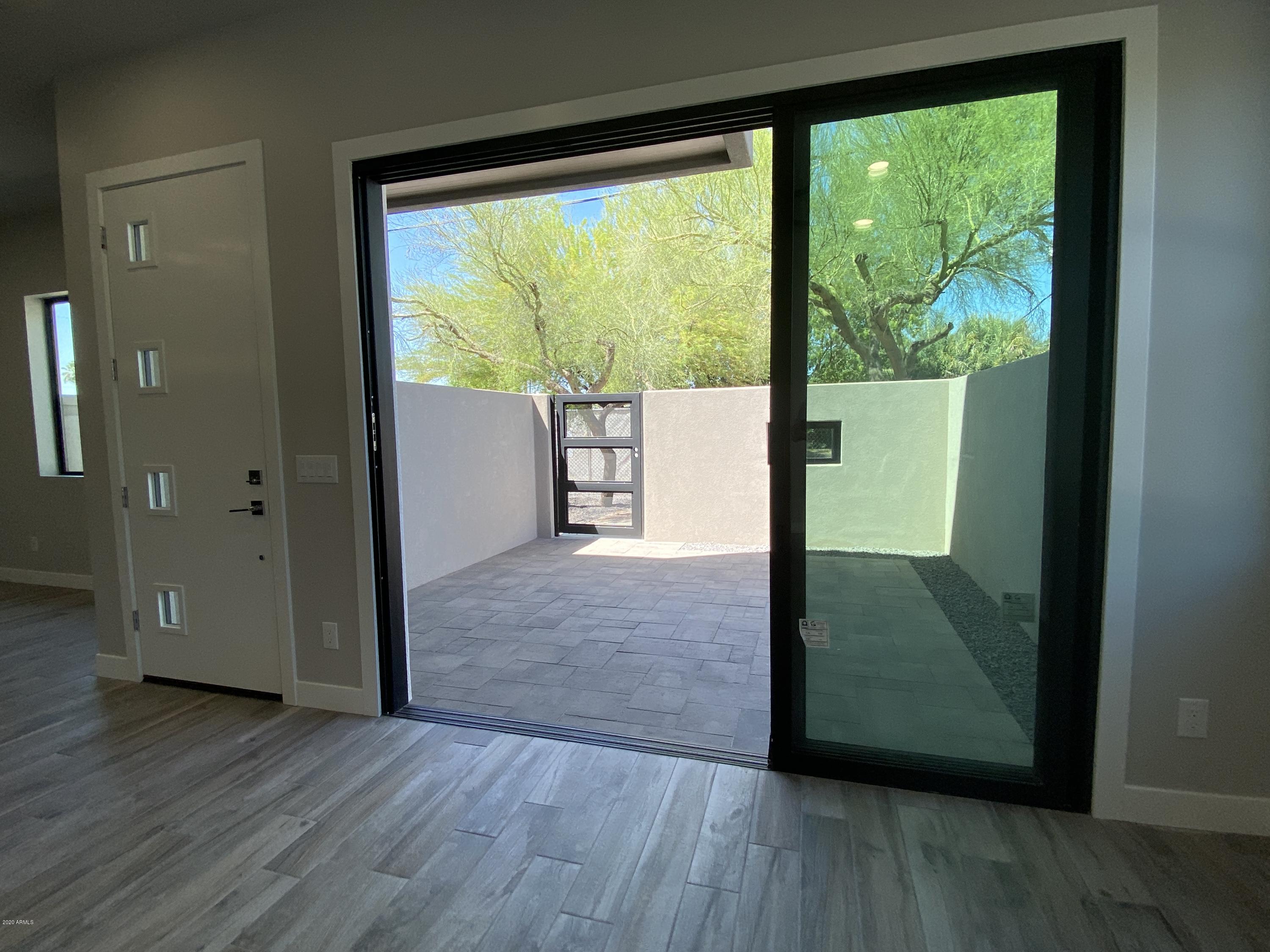 2645 East Osborn Road, Unit 6 Phoenix, AZ 85016 - Photo 41 of 43 a view of a room with wooden floor and door