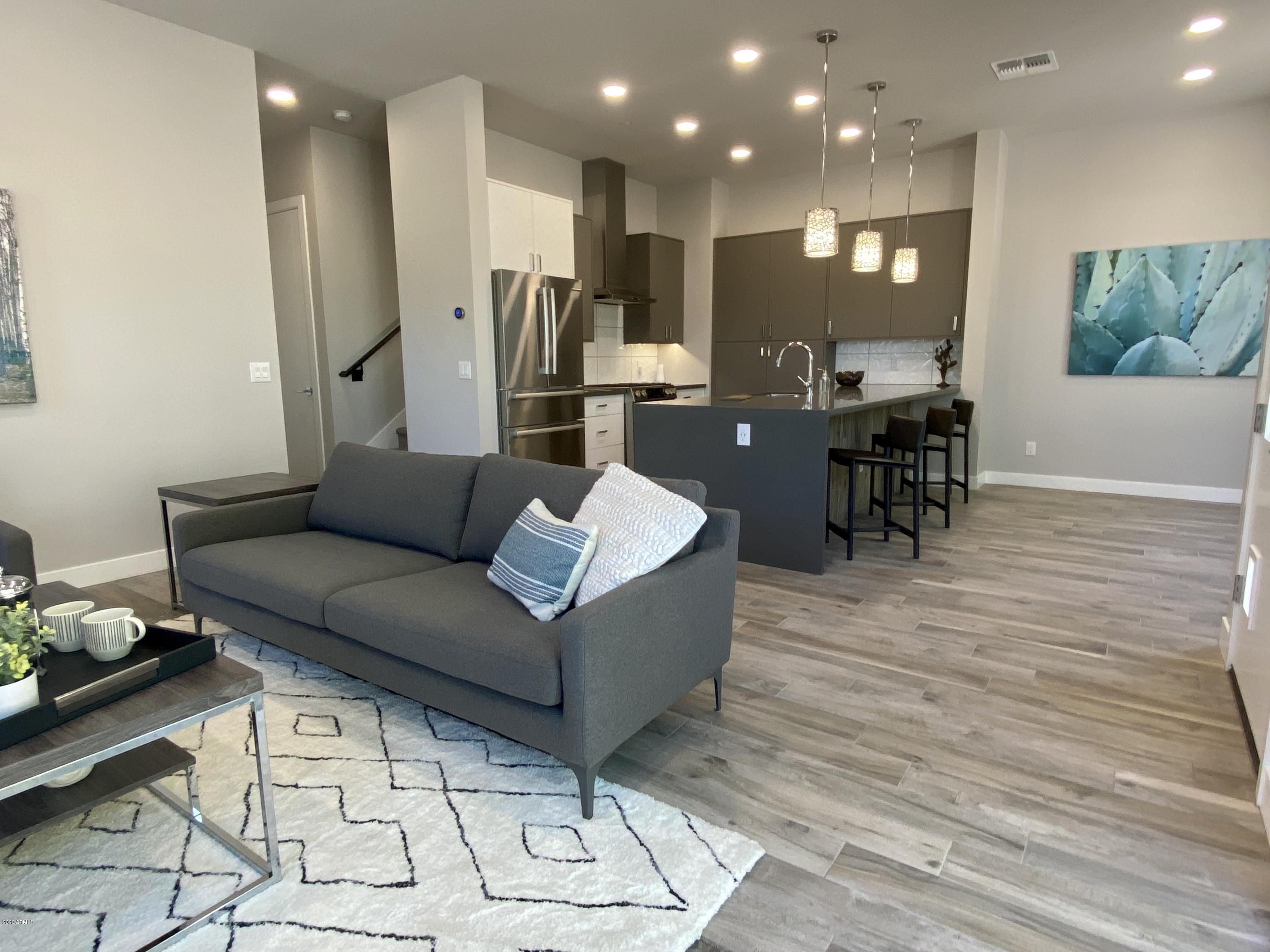 2645 East Osborn Road, Unit 6 Phoenix, AZ 85016 - Photo 5 of 43 a living room with furniture and kitchen view