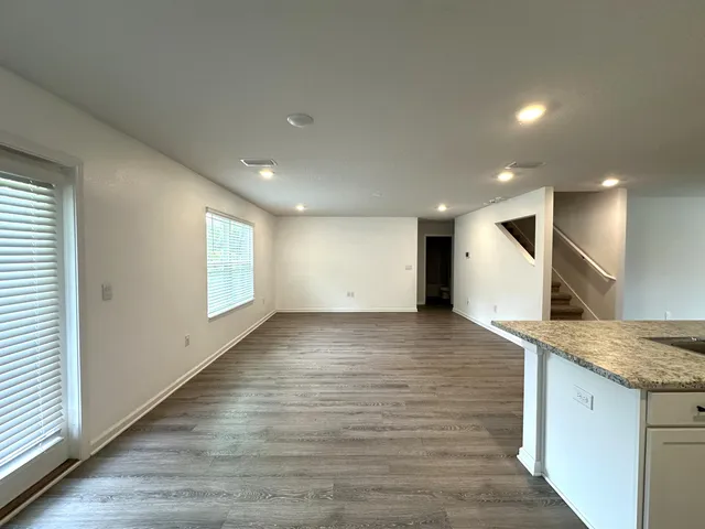 a view of a kitchen cabinets and a wooden floor