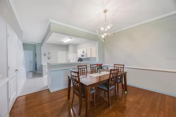 a living room with furniture and kitchen view