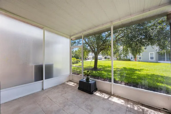 an aerial view of a house with a garden and lake view