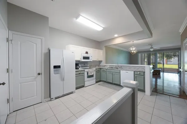 a kitchen with a sink stove and microwave