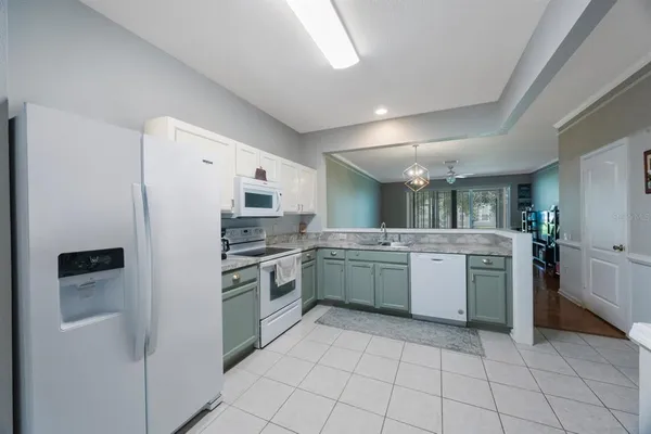 a view of a dining room with furniture wooden floor and chandelier