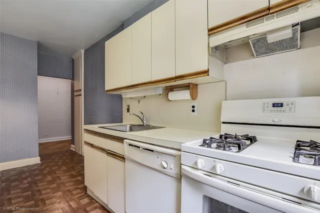 a kitchen with a stove and a refrigerator