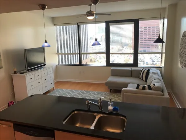 a living room with furniture and a flat screen tv