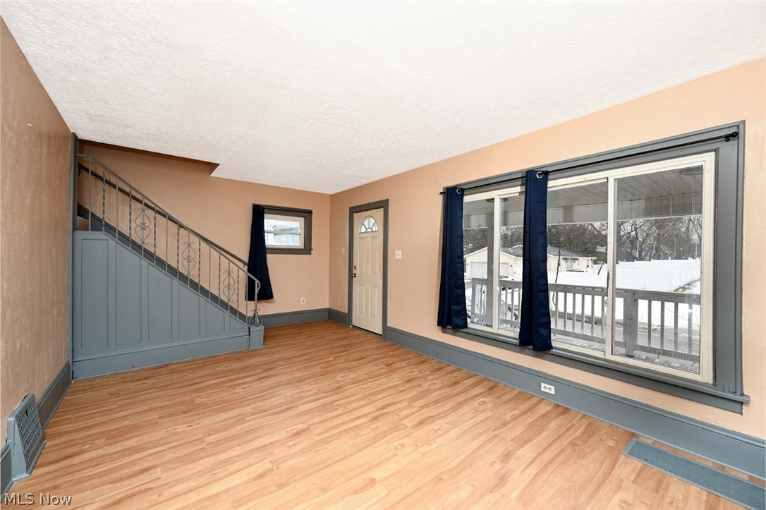 77 West Mildred Avenue Akron, OH 44310 - Photo 7 of 40 Foyer with light wood-style floors and a textured ceiling