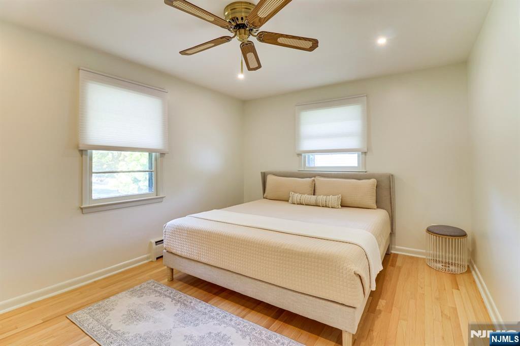 213 Haroldson Place Pompton Lakes, NJ 07442 - Photo 12 of 26 a bedroom with a bed and painting on the wall