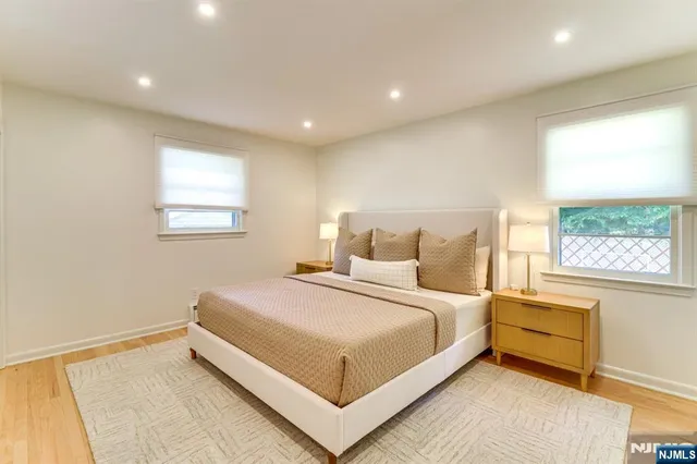 a bedroom with a large bed and a window