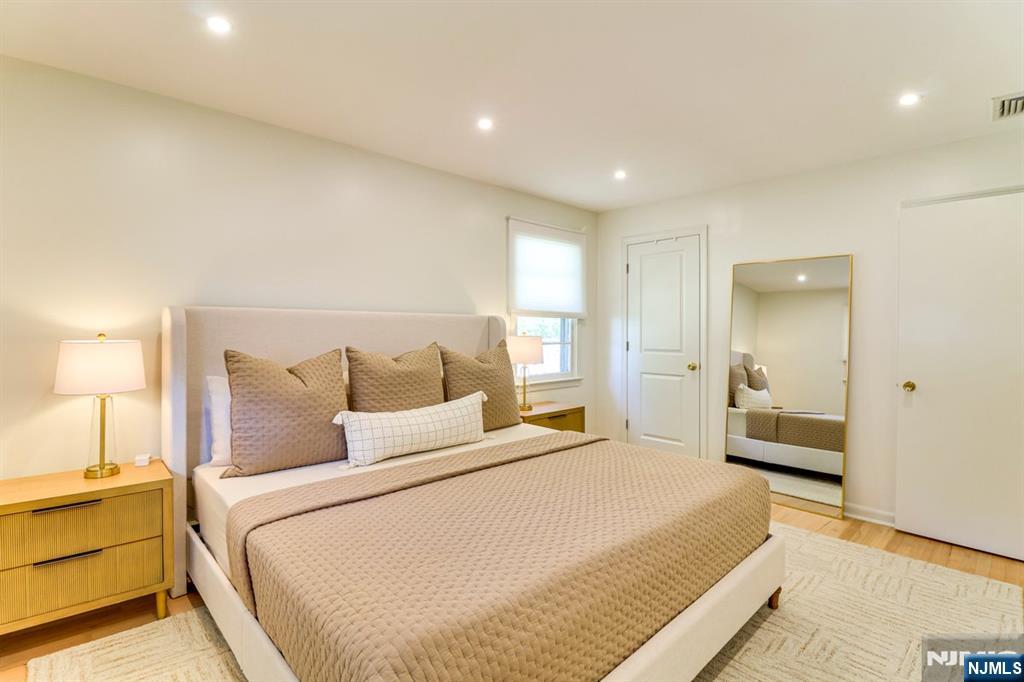 213 Haroldson Place Pompton Lakes, NJ 07442 - Photo 16 of 26 a bedroom with a bed and a large window