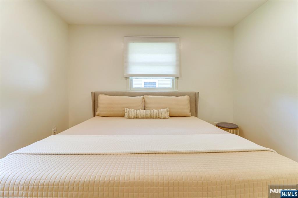 213 Haroldson Place Pompton Lakes, NJ 07442 - Photo 18 of 26 a bedroom with a bed and window