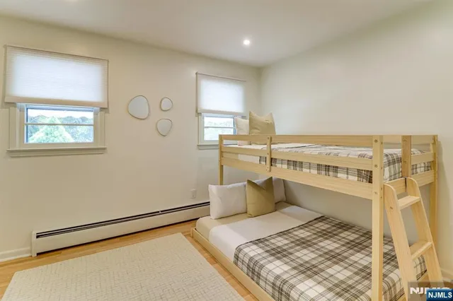 a bedroom with a bed and balcony view