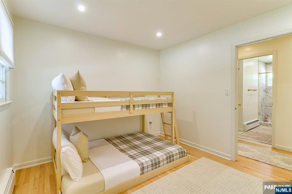 213 Haroldson Place Pompton Lakes, NJ 07442 - Photo 20 of 26 a bedroom with a bed and a cabinets