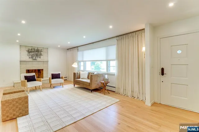 a living room with furniture window and a table